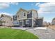 Large backyard with a patio, gravel area, and partial grass at 16595 E 110Th Ave, Commerce City, CO 80022