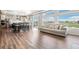 Bright open-concept living area with expansive windows and a seamless flow to the kitchen at 16595 E 110Th Ave, Commerce City, CO 80022