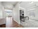 Inviting home office space with ample natural light, custom built-ins, and sleek wooden desk at 16595 E 110Th Ave, Commerce City, CO 80022