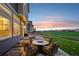Inviting patio with comfortable seating and a fire pit, perfect for outdoor entertaining at 16595 E 110Th Ave, Commerce City, CO 80022