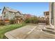 Well-maintained backyard with concrete patio and wooden fence at 17859 E 108Th Pl, Commerce City, CO 80022