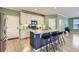 Kitchen featuring a central island, granite countertops, and stainless steel appliances, perfect for cooking at 17859 E 108Th Pl, Commerce City, CO 80022