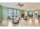 Open-concept living room with modern furnishings and abundant natural light, creating a comfortable atmosphere at 17859 E 108Th Pl, Commerce City, CO 80022