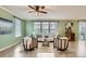 Bright and airy living room with modern furniture and a view of the backyard at 17859 E 108Th Pl, Commerce City, CO 80022