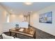 Bright loft area with neutral walls, carpeted floors, and a painting on the wall at 17859 E 108Th Pl, Commerce City, CO 80022