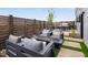 Chic outdoor living area with modern seating, fire pit, and privacy fencing, perfect for entertaining at 10886 E Hinsdale Cir, Centennial, CO 80112