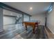 Spacious finished basement with a pool table, neutral gray walls, and vinyl floors at 3288 W Tufts Ave, Englewood, CO 80110