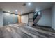 This is a finished basement with gray walls and vinyl floors and a mirror at 3288 W Tufts Ave, Englewood, CO 80110