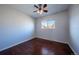 Bright bedroom featuring hardwood floors and a ceiling fan, perfect for relaxing at 3288 W Tufts Ave, Englewood, CO 80110