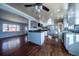 Modern kitchen boasting stainless steel appliances, granite countertops, and white cabinets at 3288 W Tufts Ave, Englewood, CO 80110