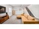 Finished basement showcasing a plush sectional sofa, entertainment center, and staircase to the main level at 1333 Raleigh St, Denver, CO 80204
