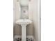 Bathroom with a pedestal sink and stylish floor tiles at 1333 Raleigh St, Denver, CO 80204