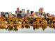 Beautiful shot of the Denver skyline reflecting on Sloan's Lake during autumn at 1333 Raleigh St, Denver, CO 80204