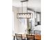 Dining area with a modern pendant light fixture above a wooden table and seating at 1333 Raleigh St, Denver, CO 80204