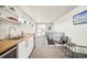 Stylish kitchenette features a modern sink, butcher block countertop, and stainless steel appliances at 1333 Raleigh St, Denver, CO 80204