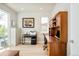 Well-lit office with built-in cabinets, a large window, and hardwood floors at 1333 Raleigh St, Denver, CO 80204