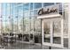 Exterior of Cholon restaurant featuring a glass facade, outdoor seating, and modern design at 1333 Raleigh St, Denver, CO 80204
