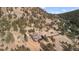 Majestic mountain home with long driveway surrounded by trees, offering privacy and scenic views at 127 Granite Way, Evergreen, CO 80439