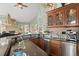 Wet bar with stainless steel appliances, granite countertops and an interesting view at 127 Granite Way, Evergreen, CO 80439