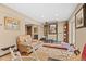 Basement gym offering workout space with weight rack, bench, mirror, and access to an outside patio at 127 Granite Way, Evergreen, CO 80439