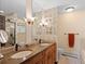 Bathroom featuring double sinks with granite countertops and glass block wall at 127 Granite Way, Evergreen, CO 80439