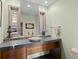 Contemporary bathroom with a vessel sink, mosaic tile backsplash, and large mirror at 127 Granite Way, Evergreen, CO 80439