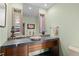 Chic powder room with a unique vessel sink and modern fixtures at 127 Granite Way, Evergreen, CO 80439