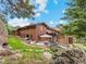Exterior of a home with stone accents and lush landscaping at 127 Granite Way, Evergreen, CO 80439