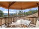 Beautiful gazebo provides stunning mountain views, creating a relaxing spot to dine and enjoy the outdoors at 127 Granite Way, Evergreen, CO 80439