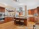 Spacious kitchen with modern appliances, custom cabinets, a large island, and hardwood floors for cooking and entertaining at 127 Granite Way, Evergreen, CO 80439