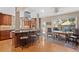 Gourmet kitchen featuring an island with seating, stone countertops, and a cozy dining area at 127 Granite Way, Evergreen, CO 80439