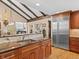 Gourmet kitchen featuring granite countertops, stainless steel appliances, custom cabinets, and an open design at 127 Granite Way, Evergreen, CO 80439