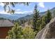 Breathtaking mountain views surround this property, showcasing the natural beauty of the area at 127 Granite Way, Evergreen, CO 80439