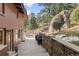 Spacious outdoor deck with stone accents, offering a great spot for grilling and entertaining at 127 Granite Way, Evergreen, CO 80439