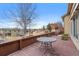 Inviting outdoor deck area with table perfect for relaxing and enjoying the open space and neighborhood views at 10650 Ashfield St, Highlands Ranch, CO 80126