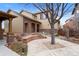 Charming two-story home showcasing the covered entrance and a manicured front yard with walkway at 10650 Ashfield St, Highlands Ranch, CO 80126