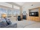 Bright living space with lots of natural light and a fireplace at 10650 Ashfield St, Highlands Ranch, CO 80126