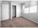 Bright bedroom with neutral walls, carpet, and a large closet at 10094 Wyandott Cir, Denver, CO 80260