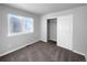 Well-lit bedroom with neutral carpeting and a closet at 10094 Wyandott Cir, Denver, CO 80260