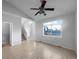 Living room with hardwood floors, large window, and staircase at 10094 Wyandott Cir, Denver, CO 80260