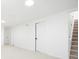 Bright basement featuring neutral paint, plush carpet, a door and stairway to the main floor at 5554 Crystal Way, Denver, CO 80239