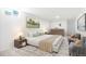 Neutral bedroom with a large window, ample natural light, and a decorative rug at 5554 Crystal Way, Denver, CO 80239