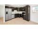 Well lit kitchen featuring stainless steel appliances, quartz countertops, and updated cabinetry at 5554 Crystal Way, Denver, CO 80239