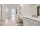 Bathroom featuring a double vanity with stone countertops, tiled floors, and a glass-enclosed shower at 15153 W Dequesne Ave, Morrison, CO 80465