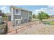 Spacious backyard with stone patio, outdoor seating and a charming garden for relaxing and entertaining at 19707 E Caspian Cir, Aurora, CO 80013
