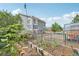 Backyard features a garden, patio, and greenhouse, creating an outdoor space for relaxation and cultivation at 19707 E Caspian Cir, Aurora, CO 80013