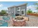 Backyard with fire pit and outdoor seating area provides a cozy space for relaxation and outdoor enjoyment at 19707 E Caspian Cir, Aurora, CO 80013