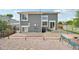 Backyard with a stone patio and outdoor seating, perfect for enjoying the outdoors and entertaining guests at 19707 E Caspian Cir, Aurora, CO 80013
