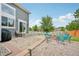 Backyard patio with outdoor seating surrounding a fire pit, perfect for entertaining guests at 19707 E Caspian Cir, Aurora, CO 80013