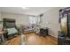 Finished basement area with wood flooring, comfortable seating, and a television at 19707 E Caspian Cir, Aurora, CO 80013